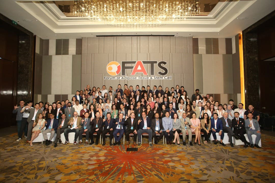 Full delegate group photograph beneath the FATS Forum of Adipose Tissue and Stem Cell logo