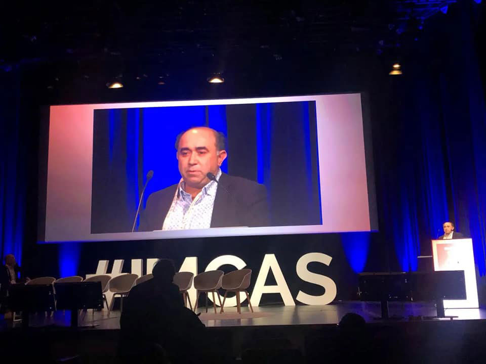 Copcu projected on the main screen above the IMCAS stage while presenting